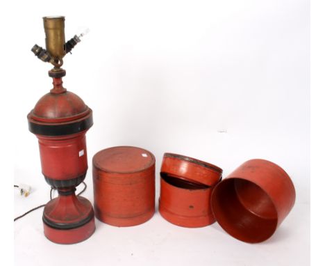 A red and black painted toleware lamp and two papier-maché circular Eastern boxes