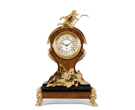 An Italian bracket clock of Louis XV design, the simulated Boulle type case gilt metal mounted and surmounted by a cherub, wi