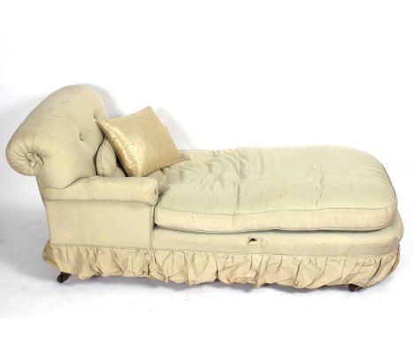 A Victorian button upholstered day bed, on turned legs with ceramic castors, 170cm long x 74cm wide