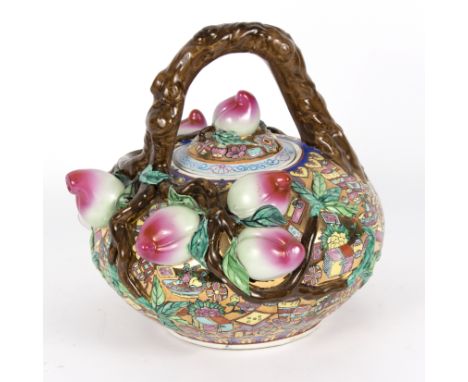 A Chinese porcelain teapot, 20th Century, decorated peaches and enamelled in colours to a gilt ground, painted peach mark und