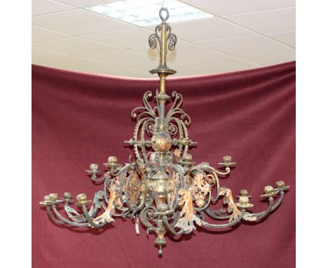 A late 19th Century gilt brass and copper six-branch eight-light chandelier with applied floral decoration