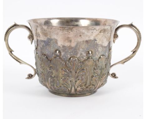 A late 17th Century style silver porringer, London 1896, with S scroll handles and stiff leaf decoration, approximately 233gm