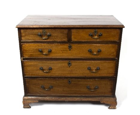 An early 19th Century mahogany chest of two short over three long drawers raised on ogee bracket feet, 84cm wide