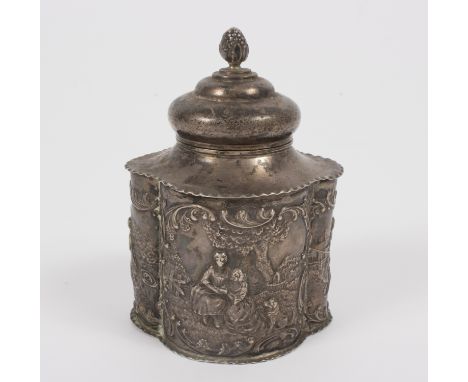 A silver tea caddy, William Comyns, London 1900, of quatrefoil form with pine cone finials to the cover, embossed pastoral sc