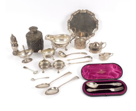 A quantity of silver to include a Queen Anne caster, an embossed tea caddy and cover, a salver, a George III cream jug, vario