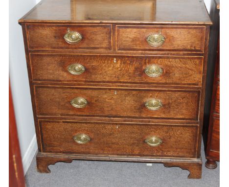 A George III oak and inlaid chest of two short over three long drawers on bracket feet, 96.5cm wide