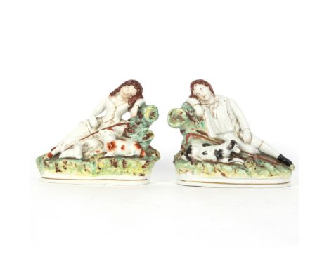 A pair of Staffordshire figures of a shepherd and shepherdess, 14cm high   Condition Report:  Female figure has some crazing 
