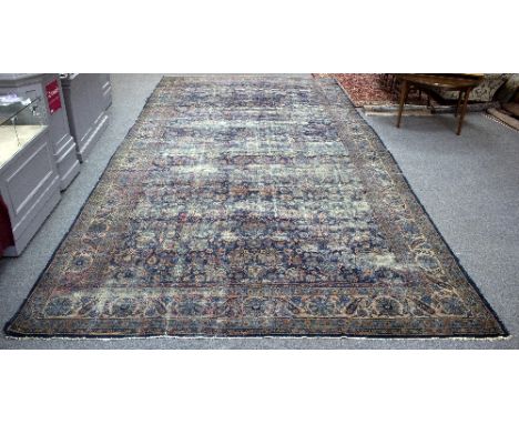 A large Meshed carpet, North East Persia, circa 1935, signed to one end, 702cm x 346cm/Provenance: The Old Manor House, Tetbu