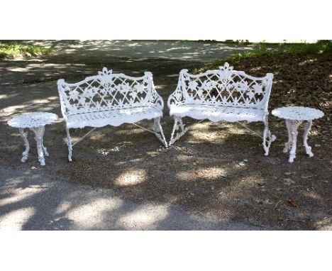 A pair of Victorian style garden benches with bramble detailing to backs and scroll sides, 104cm wide and a pair of side tabl