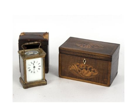 An early 19th Century tea caddy, inlaid a shell patera to the top and front, 18cm wide and a gilt brass cased carriage clock 