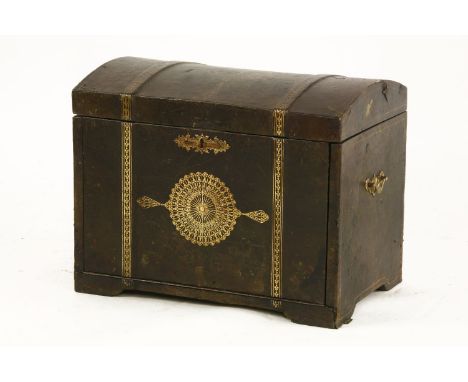 A 17th century Spanish style dome topped leather and embossed trunk, the lid and front with inset gilt motif, 53 x 35 x 40cm