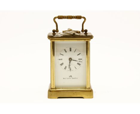 A 20th century brass and five glass carriage clock, the white dial with Roman numerals, signed Matthew Norman