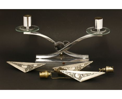 A chrome double-light desk lamp,after a design by Jacques Adnet,37.5cm wide, andthree chrome wall lights,24cm high (4)