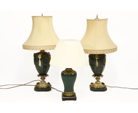 A pair of faux marble table lamps and shades, together with another table lamp