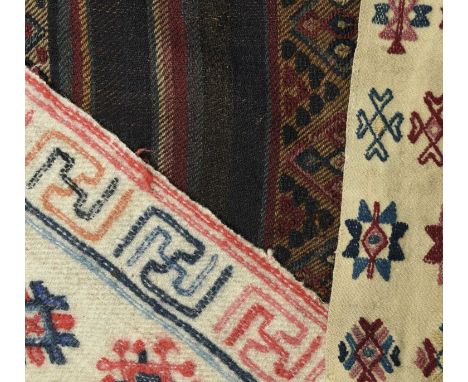 A Bhutan raincloak charkabBumthang Regionwool, the three panels with supplementary-weft brocading of geometric patterned rows