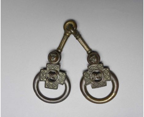 An Iron Age bronze articulated horse bitcirca 300 BC - 100 ADthe two link mouthpiece riveted to the ring ends, each with a cr