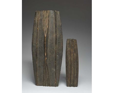 Two currency bangle mouldsWest Africacarved wood, 24cm and 37cm long. (2)