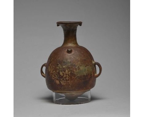 An Inca vesselPeru, circa 1200 - 1400 ADpottery, with a conical base and side handles, with a nodule to the shoulder and two 