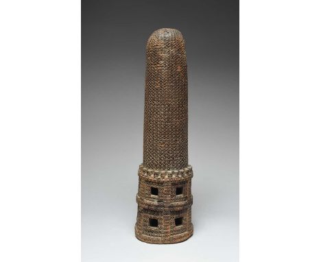 A Mangaia Island axe baseCook Islandsof cylindrical form with all over carved xs and notches,39.5cm high.ProvenanceDavid Usbo