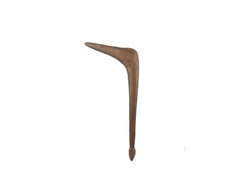 An Aboriginal leangle club Australia with an angled head and a tapered handle to a stepped conical terminal, both ends with a
