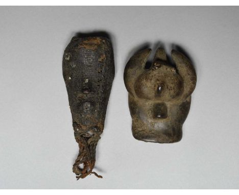 A Dan passport maskIvory Coastwith an encrusted woven fibre covering and tassel beard,15cm high, and an Ivory Coast stone/cer