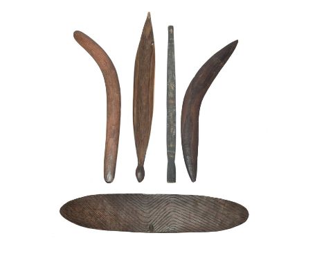 An Aboriginal shieldAustraliaof wunda type, with scorched wavy linear decoration to the front and an integral handle to the b