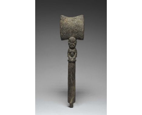 A Yoruba Shango wandNigeriawith a kneeling female figure with an axe crest,37.5cm high.