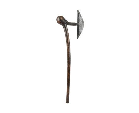 A Sotho axeSouth Africawith an iron blade and the shaft with a stylised head and burnished decoration,65.6cm long.ProvenanceD