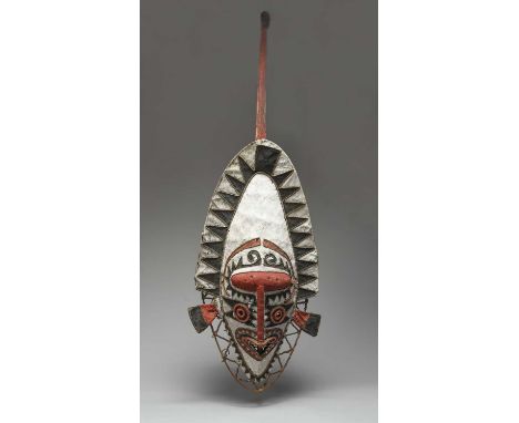 An Elema eharo maskPapuan Gulf, Papua New Guineafibre and tapa with red, white and black pigment, of helmet type with a long 