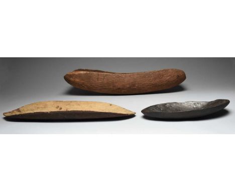 An Aboriginal coolamonAustraliawith carved channels and natural earth pigment,62.5cm long,an Aboriginal coolamon, the back ca