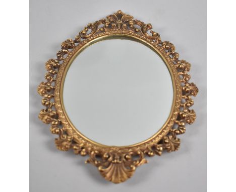 A Small Brass Framed Oval Wall Mirror, 34cms High 