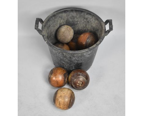 A Collection of Eight Vintage Turned Wooden Lawn Bowls, Some with Condition issues 
