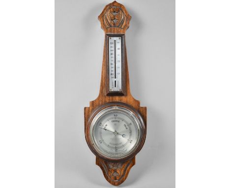 An Edwardian Carved Aneroid Barometer and Thermometer, 42cm High 