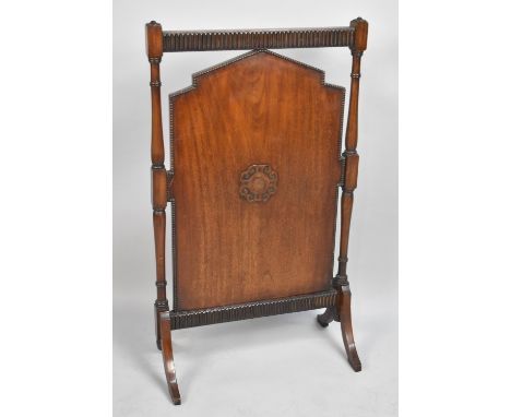 An Edwardian mahogany Fire Screen with Turned Supports, 54cms Wide 