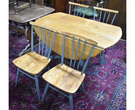 An Ercol Drop Leaf Dining Table Raised on Grey Painted Legs and Stretcher Support Together with Four Matching Spindle Back Ch