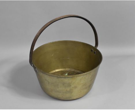 A Vintage Brass Jam Kettle with Iron Loop Handle, 31cms Diameter 