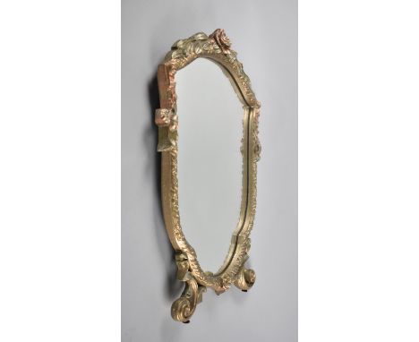 A Mid 20th Century Easel Backed Shield Shaped Mirror with Floral Garland and Scrolled Feet, 50cms high 