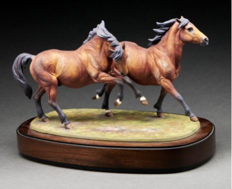A Royal Worcester equestrian model of Galloping Ponies designed by Doris Lindner, introduced 1974, 20.5cm h, black printed ma