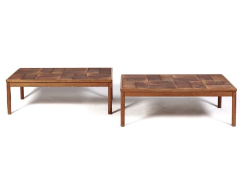 A pair of tiled wood coffee tables, 1970s, of varnished light wood on round legs, 42cm h; 62 x 125cm  Varnish worn in places,