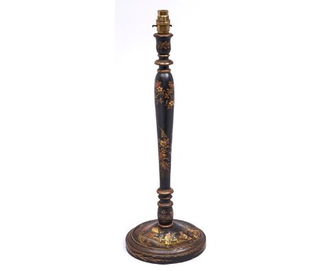 A black japanned wood table lamp, c1920, in the form of a candlestick, 51cm h excluding lamp holder Slight wear&nbsp; minor l