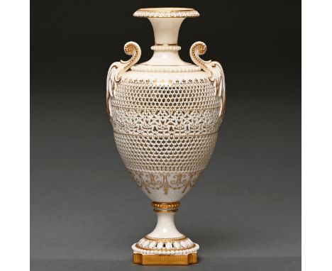 A Royal Worcester reticulated vase by George Owen, 1920, of shield shape with finely gilt beaded scroll handles and applied p