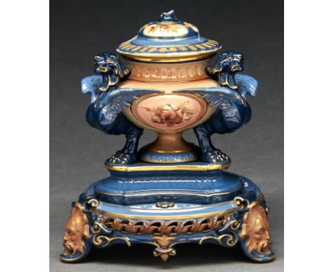 A Hadley's Worcester griffin inkwell and cover, 1897-1900, painted with pink ground panels of wild flowers and ornamented in 