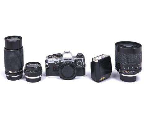 An Olympus OM10 35mm single lens reflex camera, three various lenses, including Tamron SP500mm F8 Tele Macro mirror lens and 