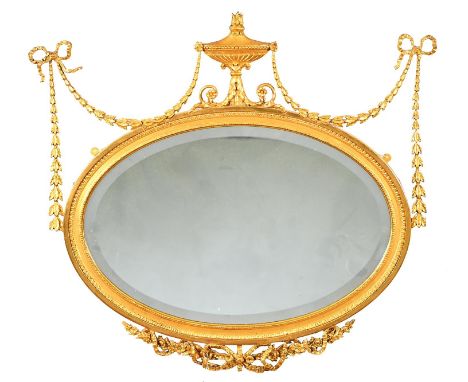 Two Edwardian oval giltwood and composition neo classical mirrors, early 20th c, the bevelled plate in egg-and-dart or beaded