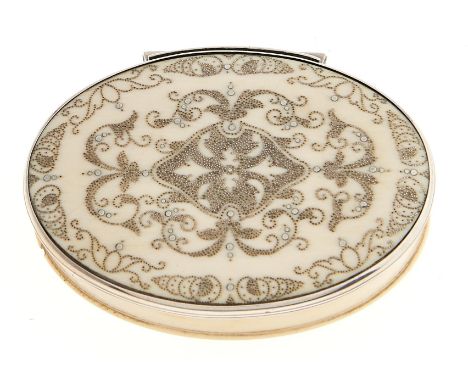 A silver mounted oval ivory pique snuff box, 18th c, with stand-away joint, 77mm l  Good quality, lacking a number of the poi