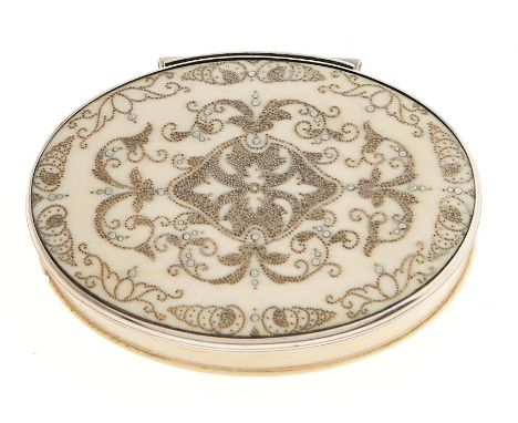 A silver mounted oval ivory pique snuff box, 18th c, with stand-away joint, 77mm l  Good quality, lacking a number of the poi