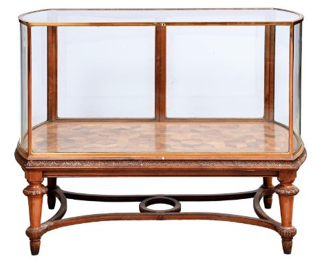 A bow ended walnut and bronze showroom cabinet, early 20th c, with pair of rear doors with drop handle and cube parquetry and