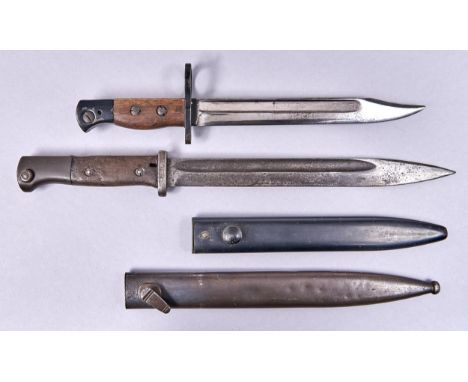 A British No5 MK1 knife bayonet, for the No5 ?jungle carbine? and the L2A3 sterling sub-machine gun, with wood grips secured 