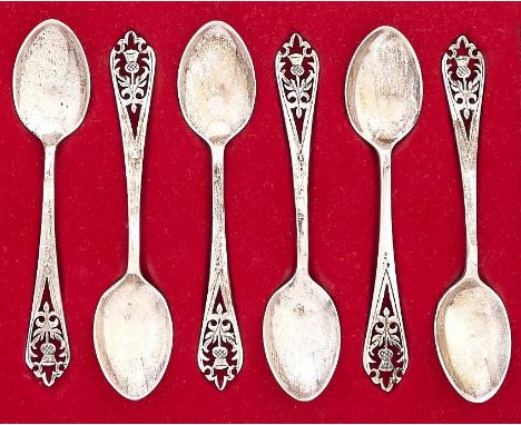 A set of six Elizabeth II thistle-pierced and engraved silver coffee spoons, by Garrard &amp; Co Ltd, Sheffield 1964, cased, 