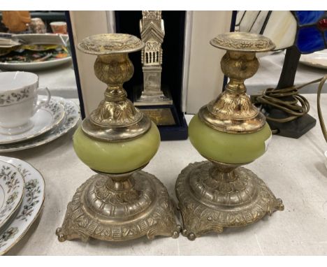 A PAIR OF VINTAGE SILVER PLATED AND ONYX CANDLESTICKS 